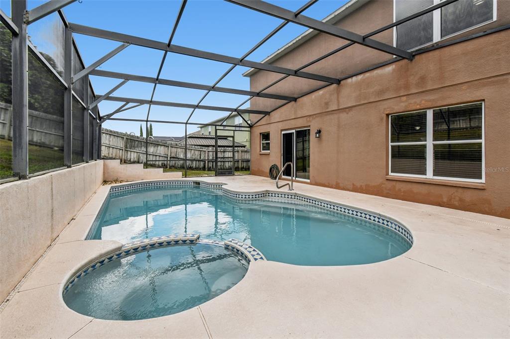 1854 Ridge Valley Street Clermont, FL 34711 - Photo 54 of 73 a view of a swimming pool with a patio