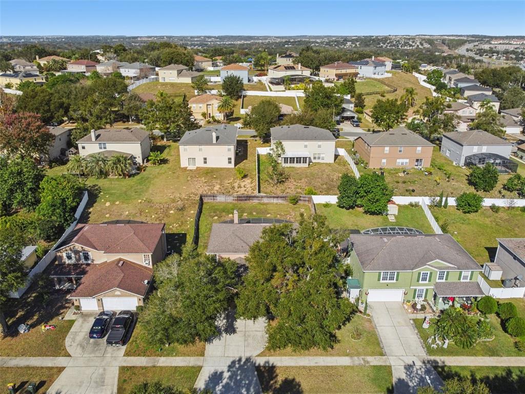 1854 Ridge Valley Street Clermont, FL 34711 - Photo 60 of 73 an aerial view of residential houses with outdoor space