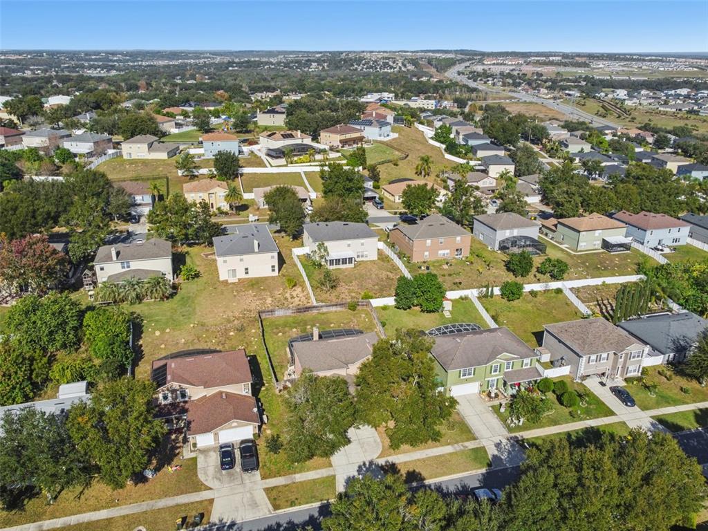 1854 Ridge Valley Street Clermont, FL 34711 - Photo 62 of 73 an aerial view of residential houses with outdoor space