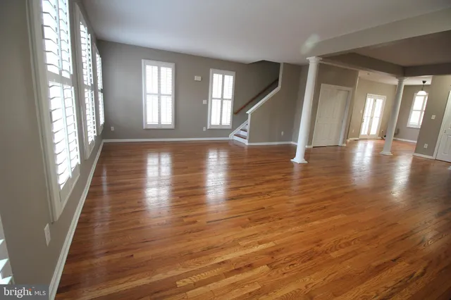 a view of an entryway with wooden floor