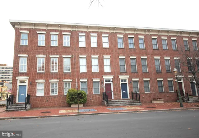 a front view of a building with street view