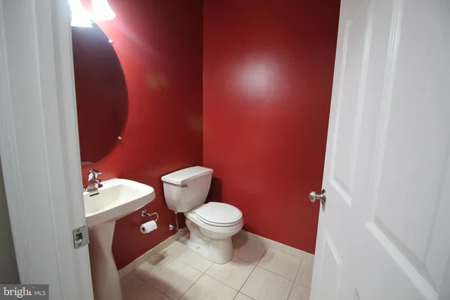a bathroom with a toilet and a sink