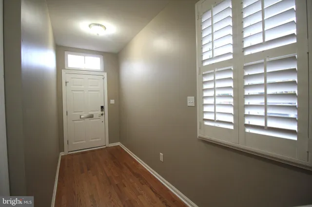 a view of an empty room and window
