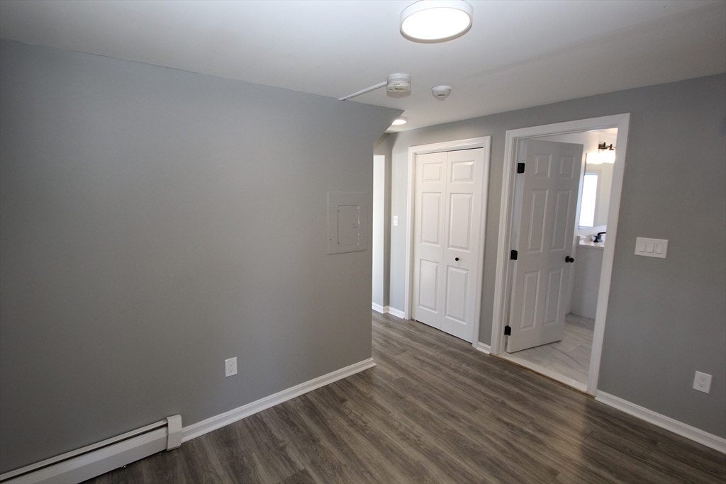 299 Main Street, Unit 2 North Reading, MA 01864 - Photo 14 of 35 a view of room with wooden floor