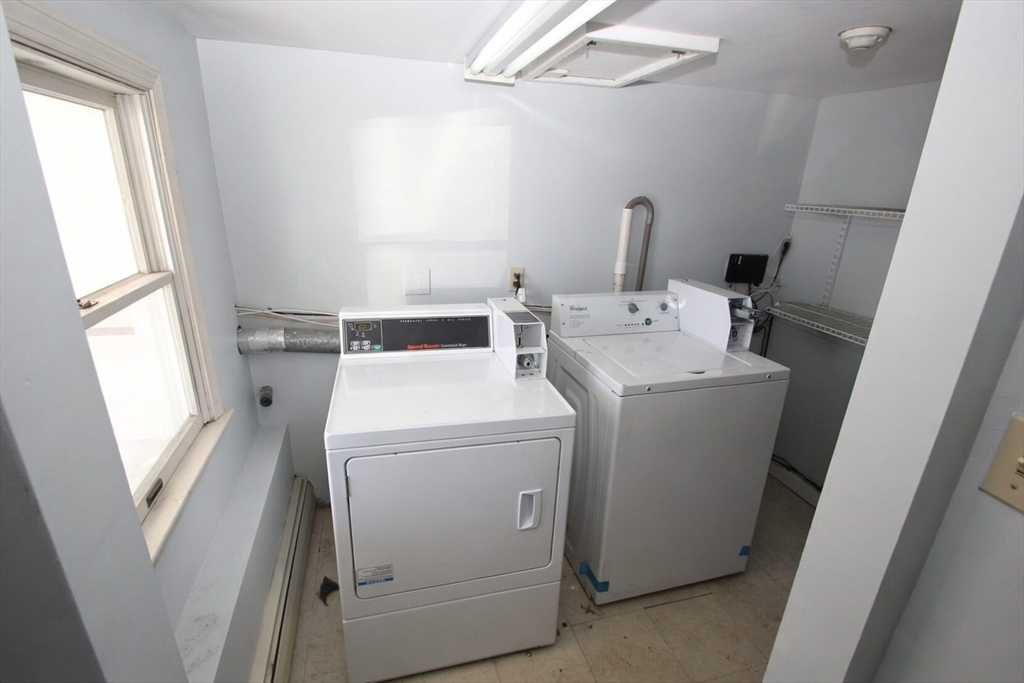 299 Main Street, Unit 2 North Reading, MA 01864 - Photo 34 of 35 a utility room with dryer and washer