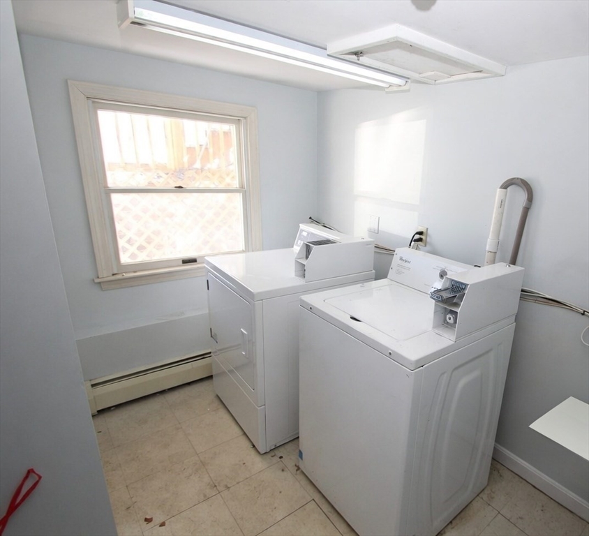 299 Main Street, Unit 2 North Reading, MA 01864 - Photo 35 of 35 a utility room with dryer and washer