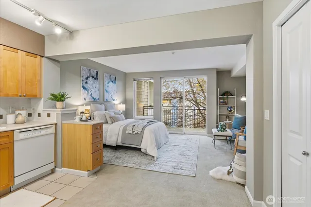 a bedroom with a bed and a large window