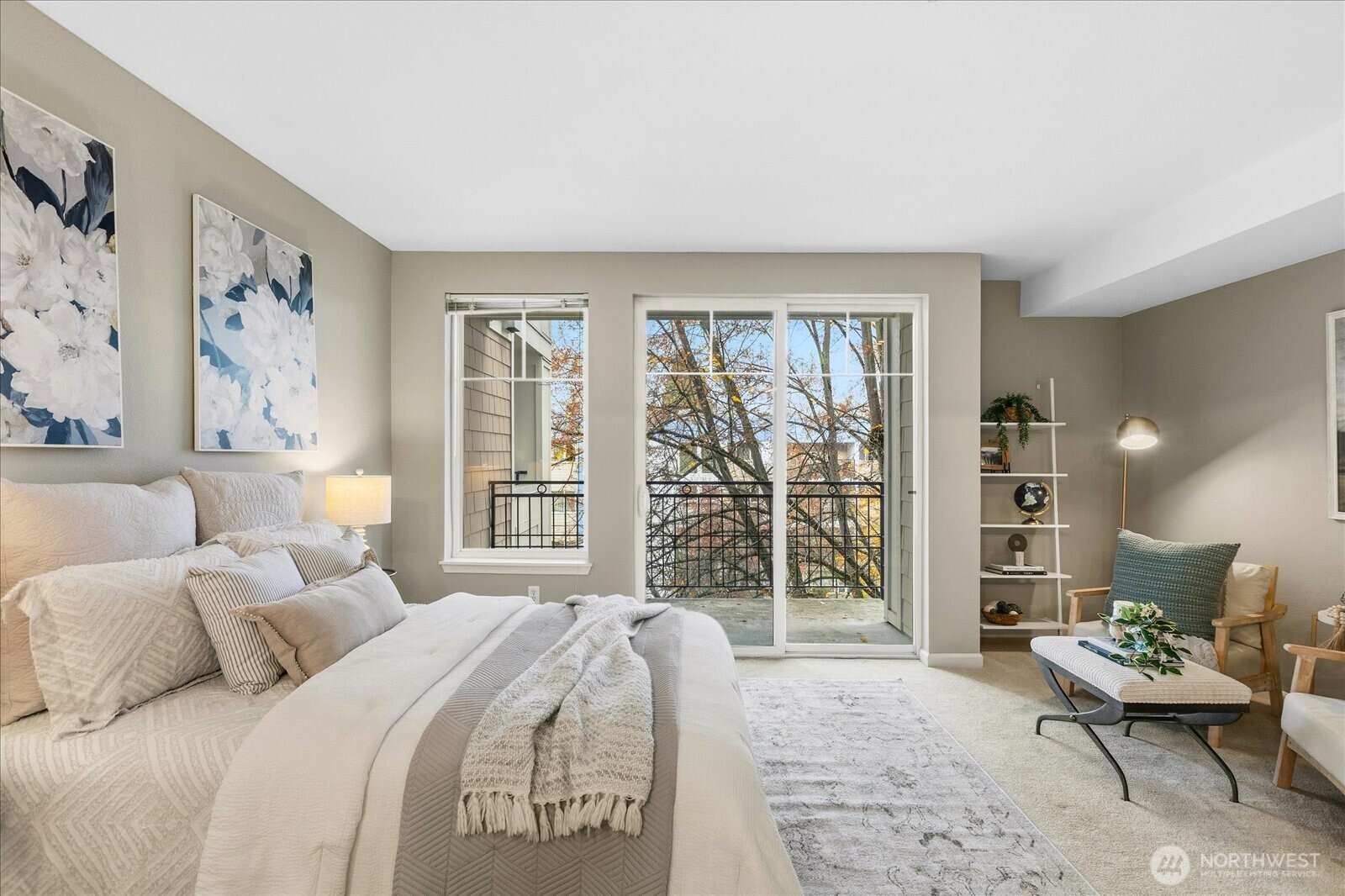 1525 Northwest 57th Street, Unit 429 Seattle, WA 98107 - Photo 12 of 26 a bedroom with a bed and glass window