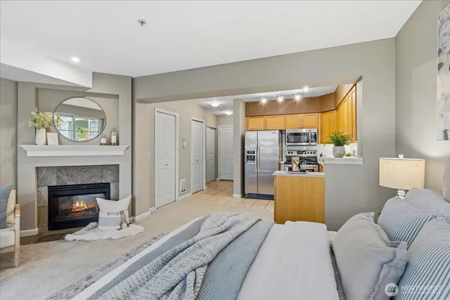 a bedroom with a bed and a fireplace