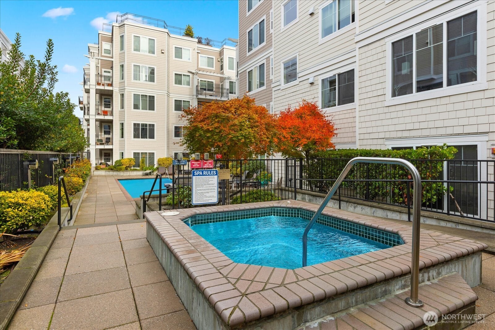 1525 Northwest 57th Street, Unit 429 Seattle, WA 98107 - Photo 24 of 26 a view of a swimming pool with a lounge chairs
