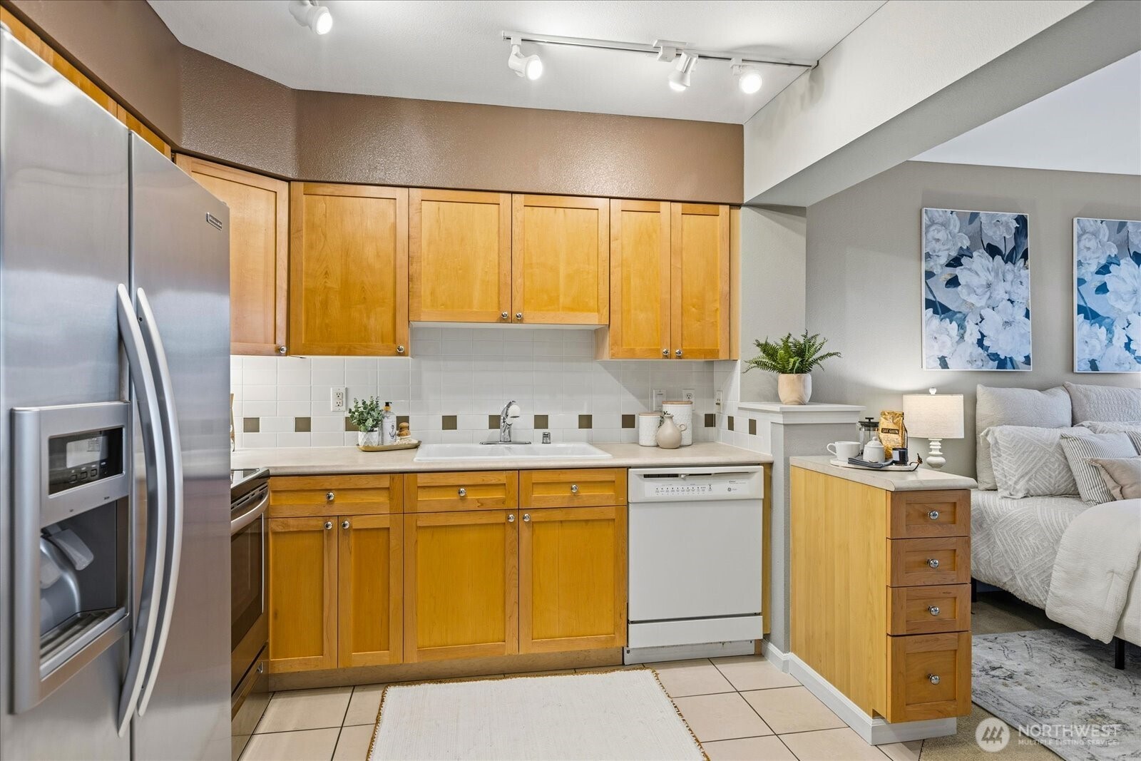 1525 Northwest 57th Street, Unit 429 Seattle, WA 98107 - Photo 7 of 26 a kitchen with a sink appliances and cabinets
