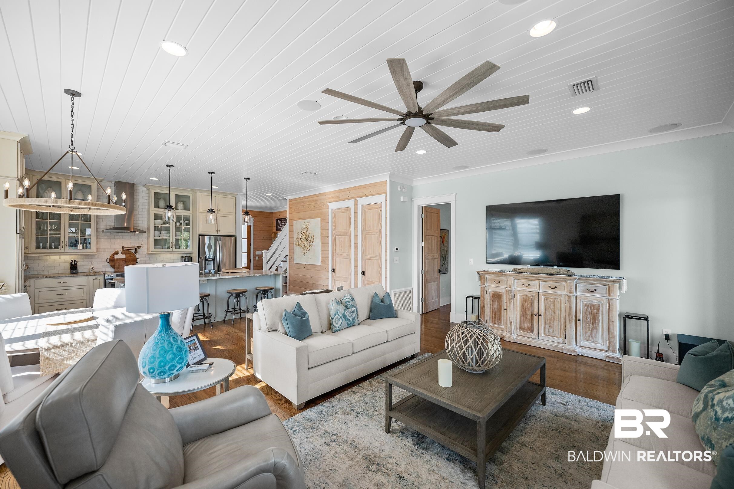 33186 Marlin Key Drive Orange Beach, AL 36561 - Photo 41 of 87 Living area with ornamental molding, dark wood-type flooring, ceiling fan, recessed lighting, and wooden ceiling