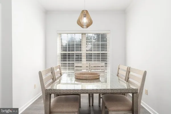 a view of a dining room with furniture and window