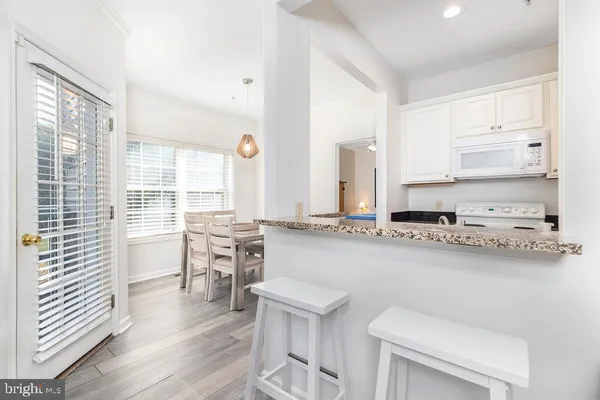 a kitchen with a sink a counter and cabinets