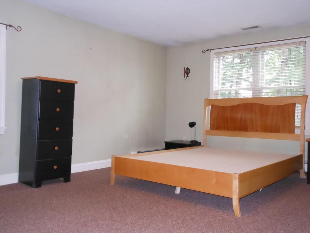 3 Outlook Road Waltham, MA 02451 - Photo 12 of 15 a bedroom with a bed and a window