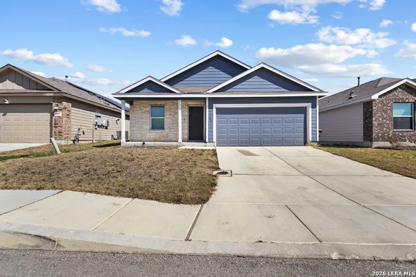 a front view of a house with garage