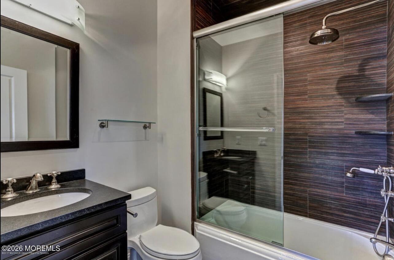 1-3 Church Street Matawan, NJ 07747 - Photo 24 of 28 a bathroom with a granite countertop sink toilet and shower