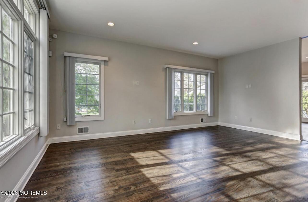 1-3 Church Street Matawan, NJ 07747 - Photo 25 of 28 an empty room with wooden floor and windows