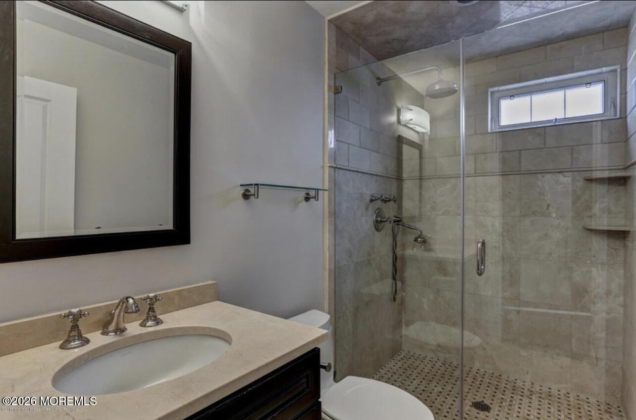 1-3 Church Street Matawan, NJ 07747 - Photo 7 of 28 a bathroom with a sink toilet and shower