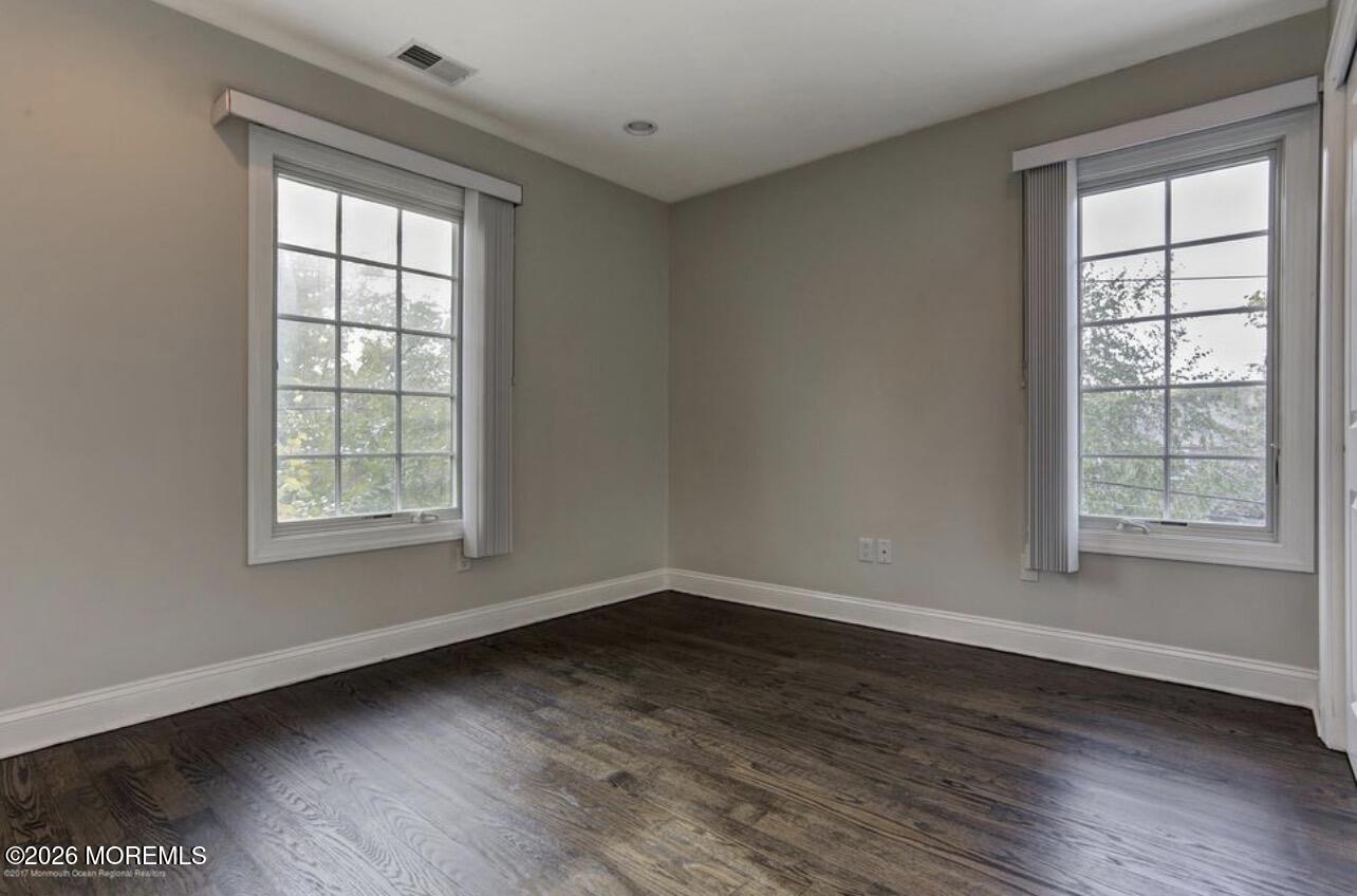 1-3 Church Street Matawan, NJ 07747 - Photo 10 of 28 an empty room with wooden floor and windows