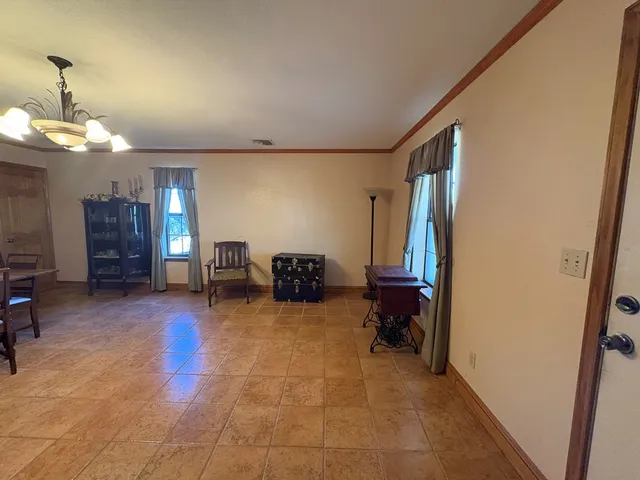 a view of a livingroom with furniture and a staircase