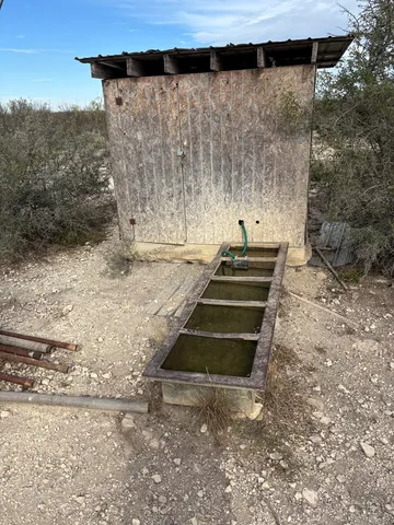 a view of a backyard with chairs
