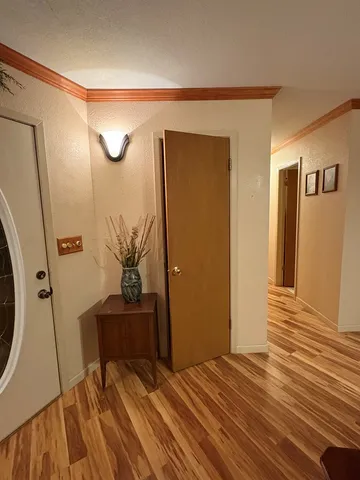 a view of a storage & utility room with wooden floor