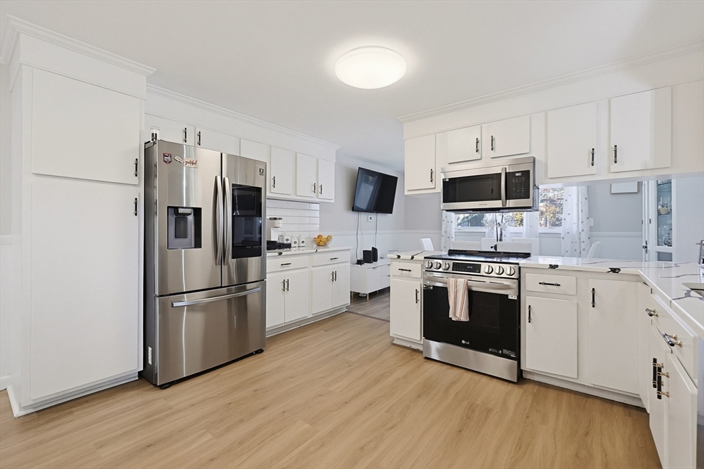 7 Miscoe Road Worcester, MA 01604 - Photo 3 of 42 a kitchen with stainless steel appliances a refrigerator sink and microwave
