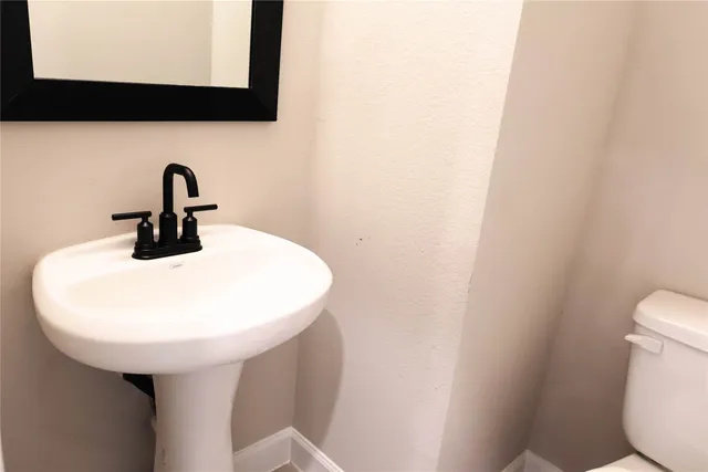 a close view of a sink and a mirror