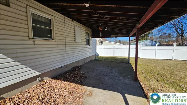 a view of a backyard of the house
