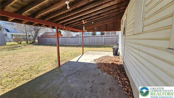 a view of a backyard of the house