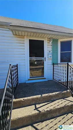a view of a house with a door and wooden floor