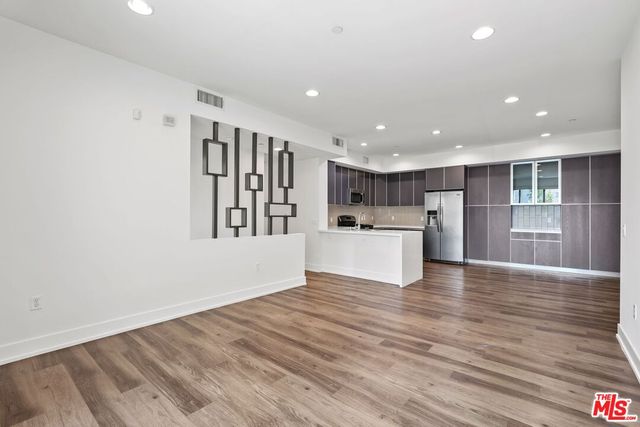 a view of kitchen with wooden floor