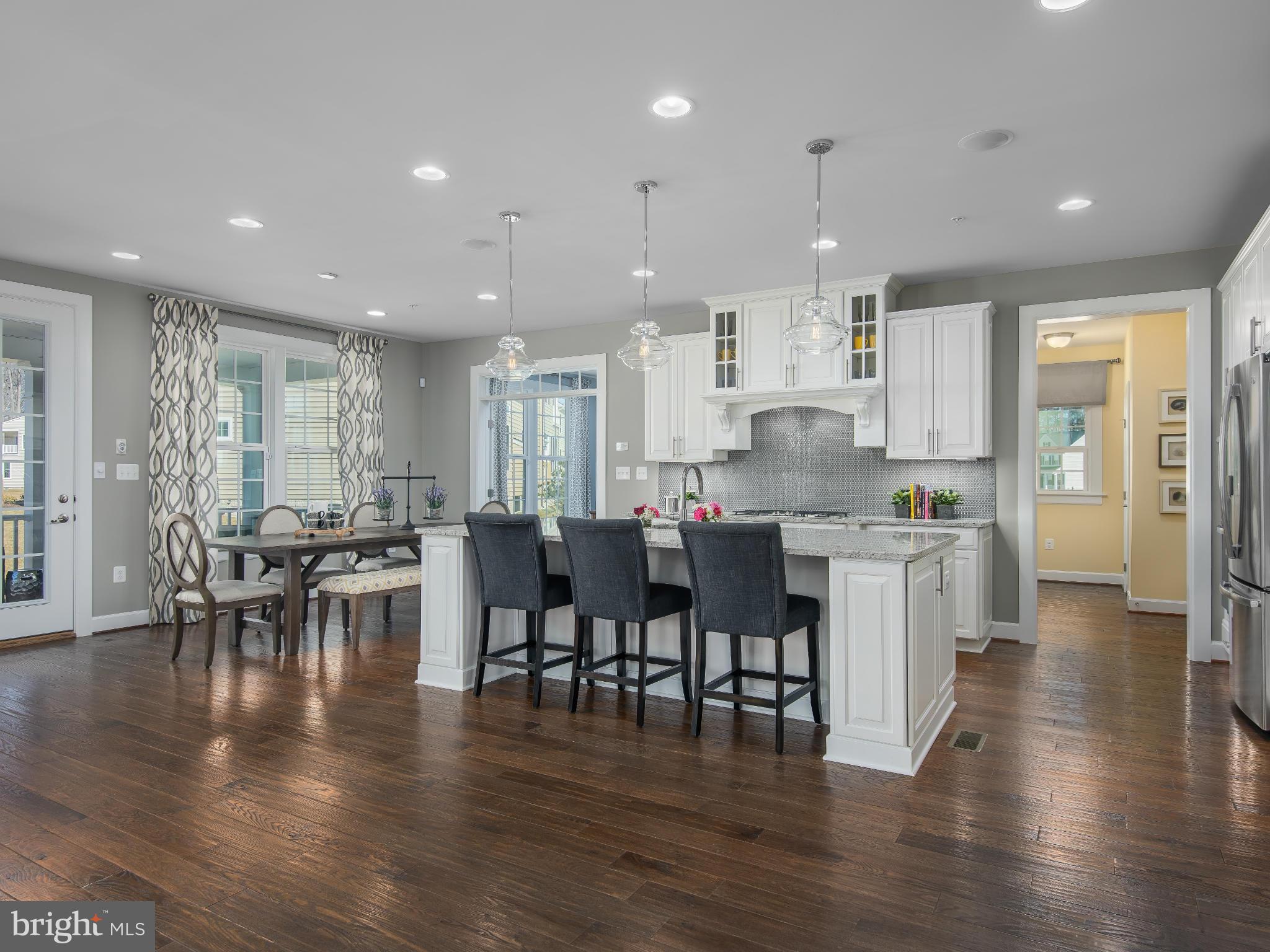20358 Peach Tree Road Dickerson, MD 20842 - Photo 7 of 18 a open kitchen with lots of counter space dining table and stainless steel appliances