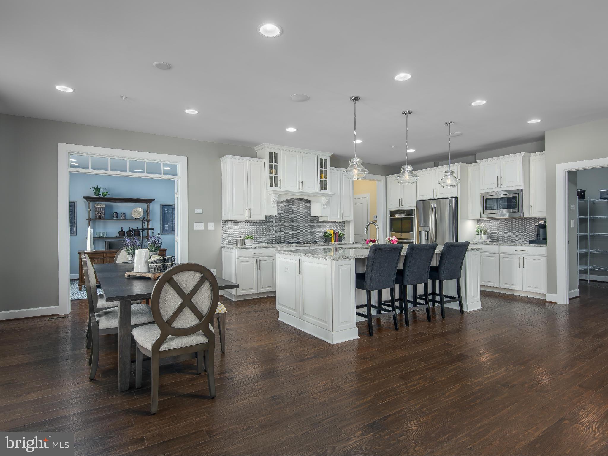 20358 Peach Tree Road Dickerson, MD 20842 - Photo 8 of 18 a open dining room kitchen with stainless steel appliances wooden floor dining table and chairs