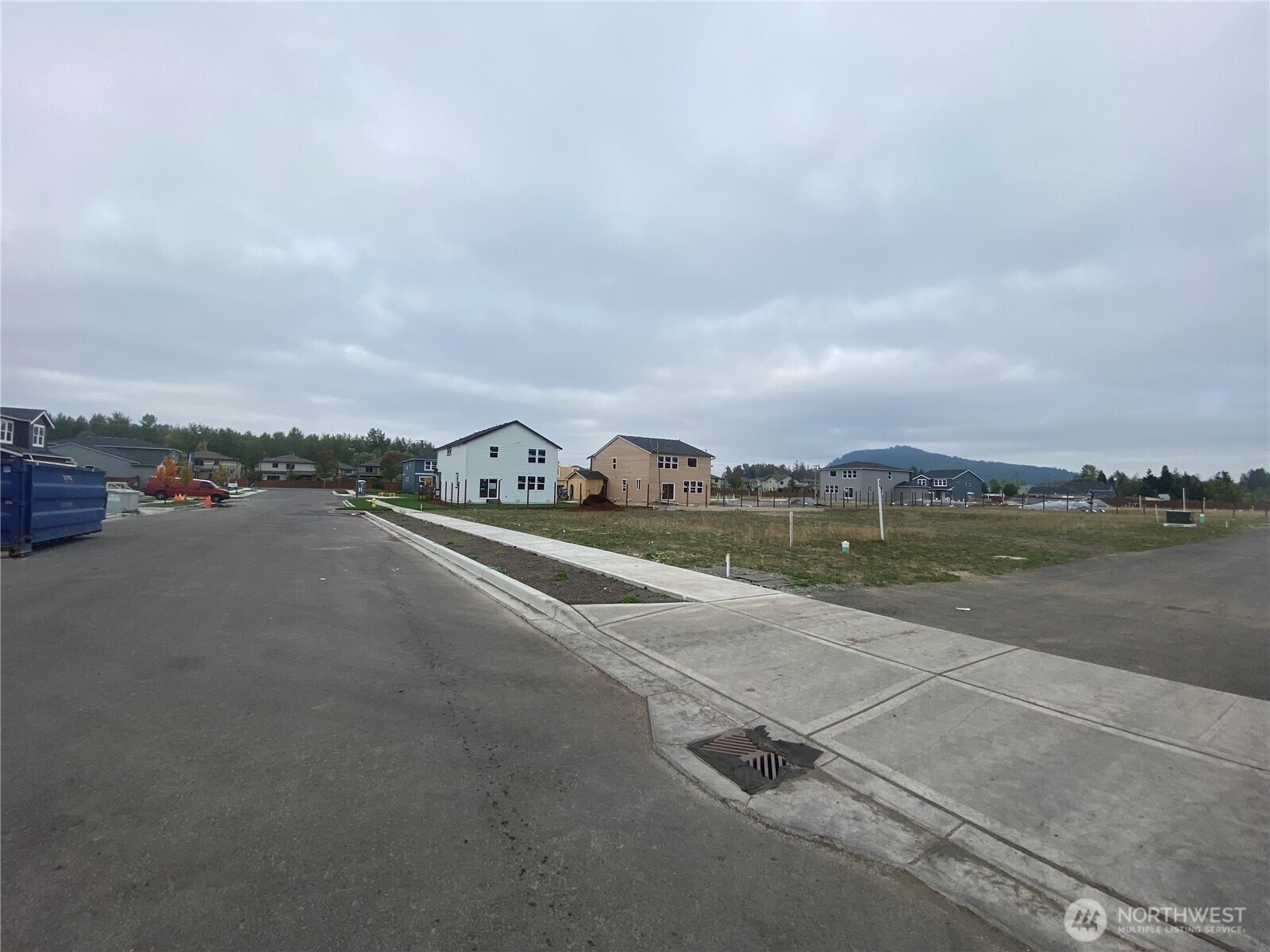an aerial view of a city street with big yard
