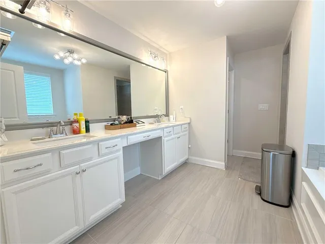 a bathroom with a sink a mirror and a toilet