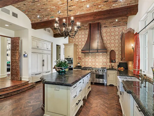 a kitchen with a sink stove and refrigerator