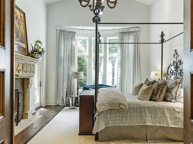 a bedroom with a bed and glass door