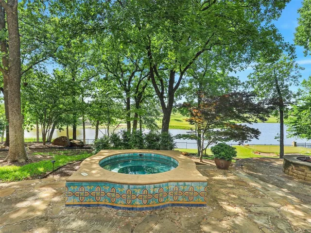 a view of a house with swimming pool and yard view
