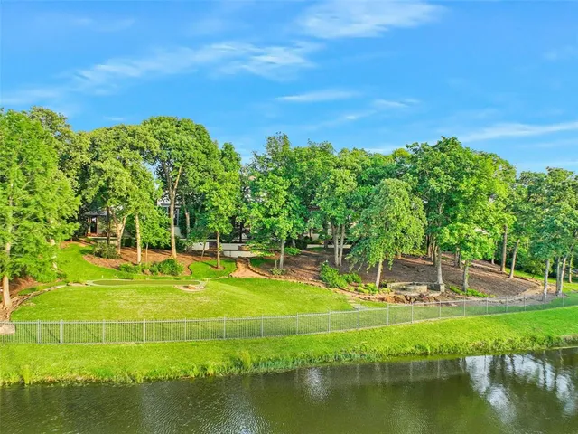 a view of a swimming pool with a yard