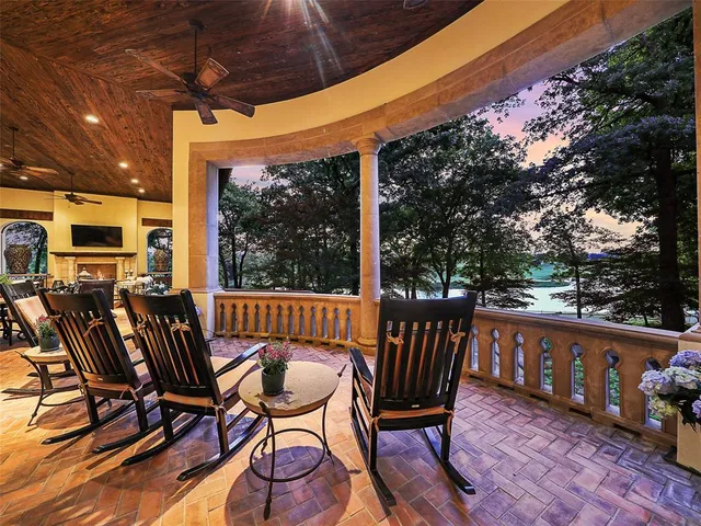 a view of a chairs and table in the patio with a fire pit