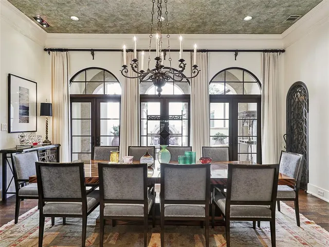 a view of a a dining room with furniture window and wooden floor