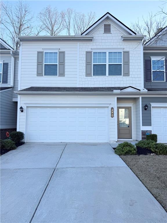 247 Centennial Circle Canton, GA 30114 - Photo 11 of 25 a front view of a house with garden