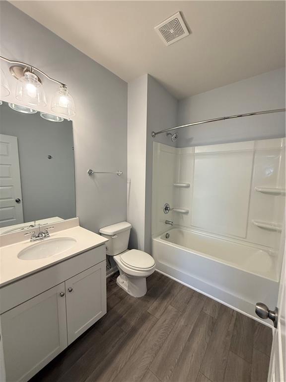 247 Centennial Circle Canton, GA 30114 - Photo 15 of 25 a bathroom with a double vanity sink toilet mirror and bathtub