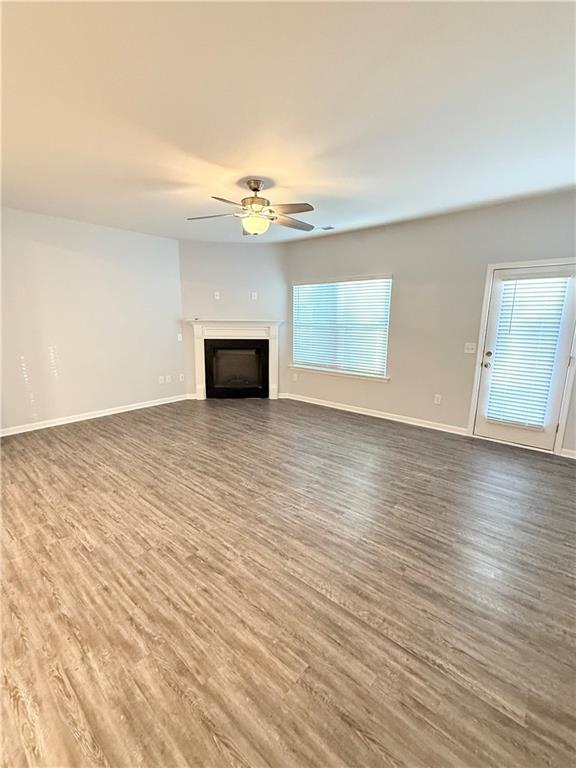 247 Centennial Circle Canton, GA 30114 - Photo 3 of 25 wooden floor in an empty room with a window