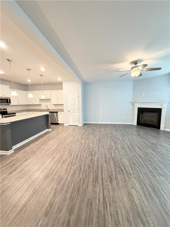 247 Centennial Circle Canton, GA 30114 - Photo 4 of 25 a view of kitchen and wooden floor