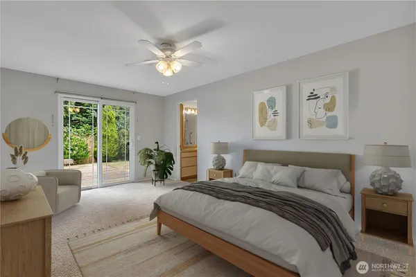 a bedroom with a large bed and a large window