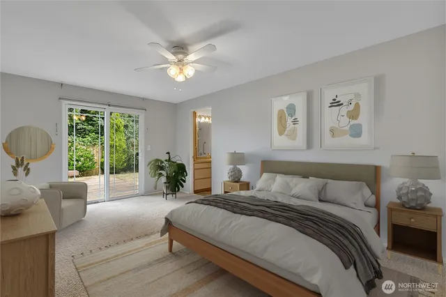 a bedroom with a large bed and a large window