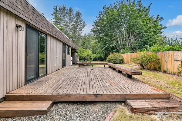 a view of backyard with patio